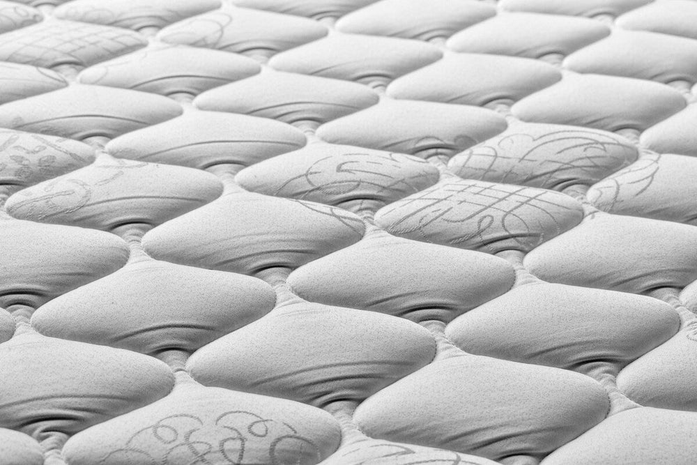 Close-up of grey bare mattress